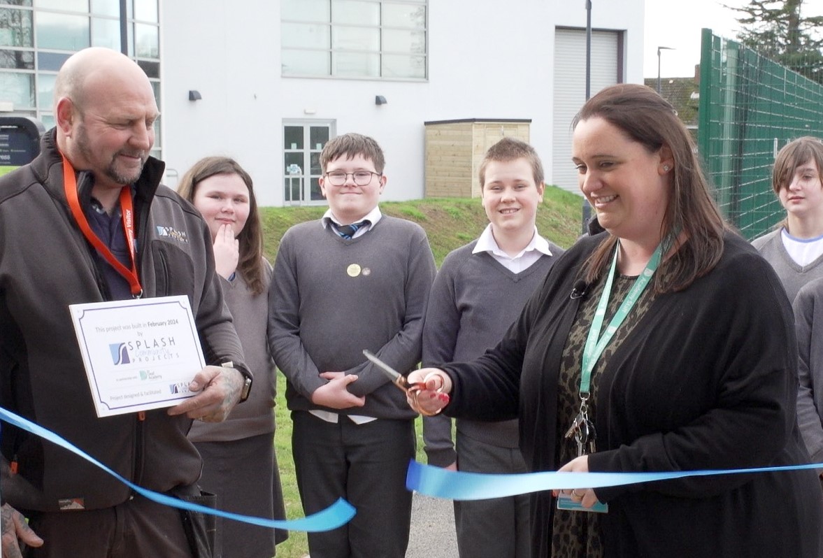 HANDOVER & RIBBON CUT STILL FRAME GRAB 1