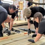 Participants working together to complete the build with Bosch tools