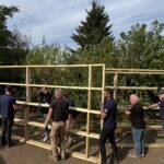 Participants working together to complete the build with Bosch tools